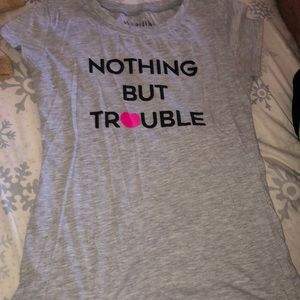 Silver color t-shirt with black wording.